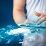 Close up of hand holding tablet with cloud network technology