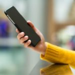 Woman holding smart phone