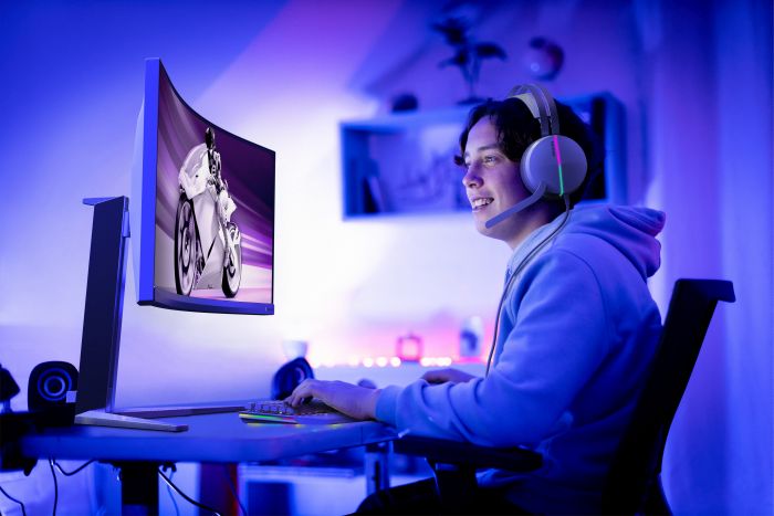 Teenager gaming online in his bedroom